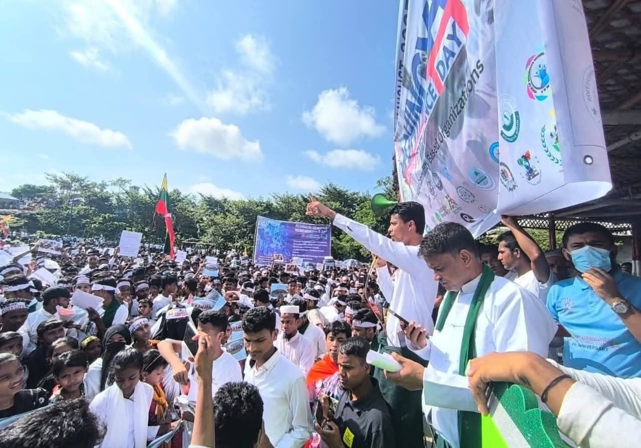 Thousands of Rohingya refugees gather at Leda Camp in Teknaf to observe Rohingya Genocide Day, demanding justice and repatriation to Myanmar.